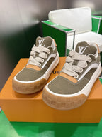 Unisex sneakers with olive uppers, white laces, tan side panels, and LV logo