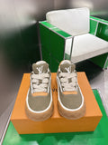 Unisex sneakers in olive canvas with white trim, tan side panels, and LV monogram
