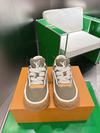 Unisex sneakers in olive canvas with white trim, tan side panels, and LV monogram