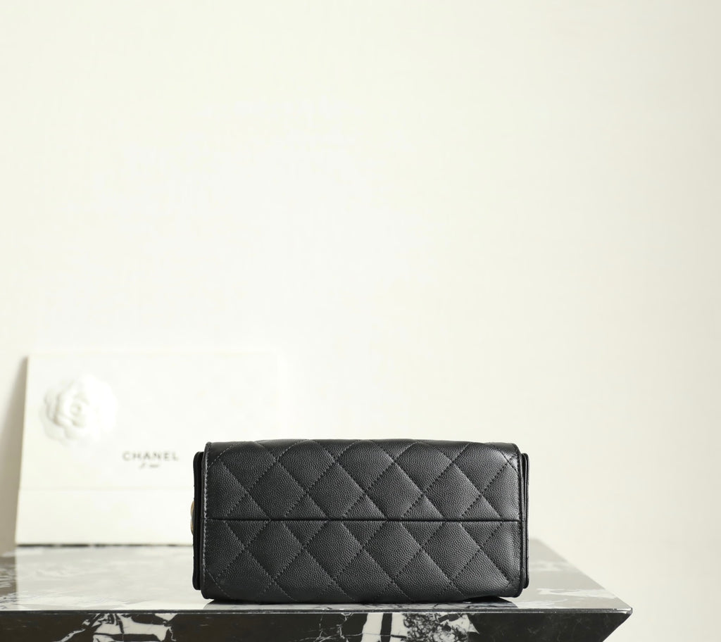 Chanel black quilted leather flap clutch-style bag with stitched diamond pattern