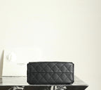 Chanel black quilted leather flap clutch-style bag with stitched diamond pattern