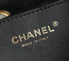 Chanel logo embossing on black leather with decorative stitch detail