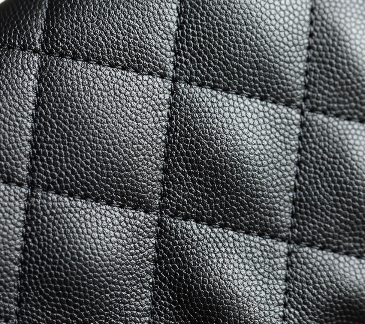 Chanel black quilted leather bag panel with stitched square pattern