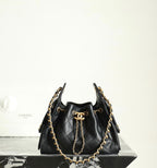 Chanel black leather bucket bag with gold chain shoulder strap and logo charm ring