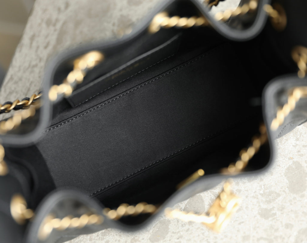 Chanel black leather bag interior and top edge with gold chain strap