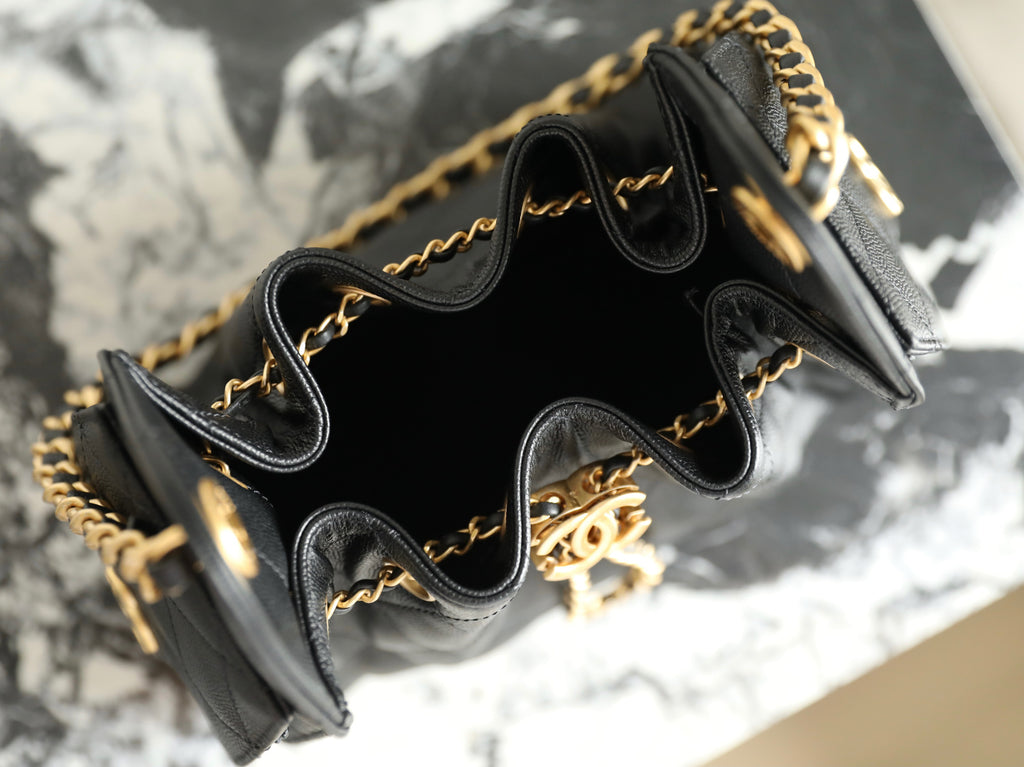 Chanel black leather bucket bag interior with gold chain trim and inner drawstring