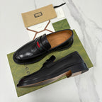Gucci black leather slip-on loafers with red green striped band across vamp