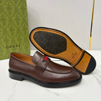 Gucci unisex leather loafer outsole and strap detail, dark brown with green-red stripe top