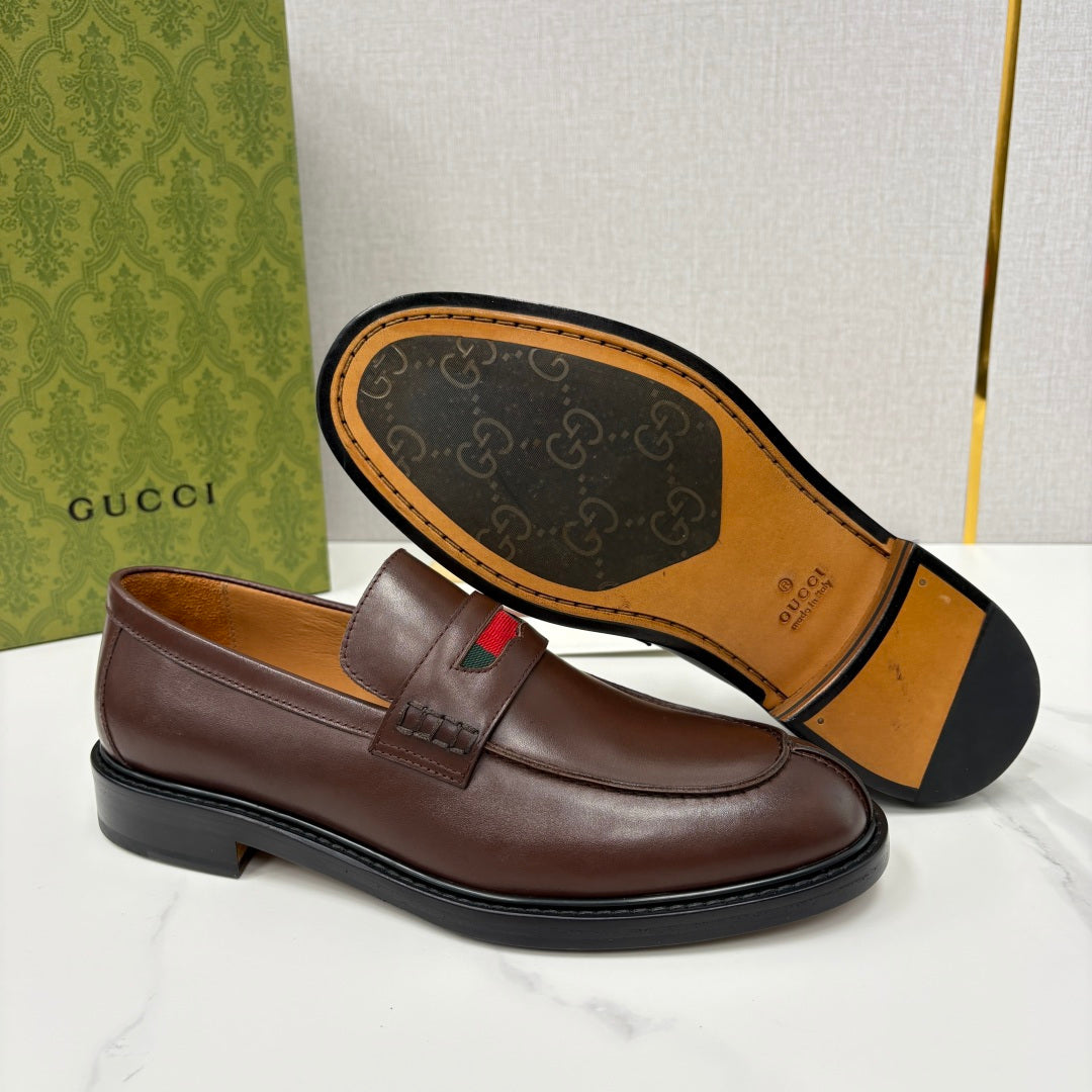 Gucci unisex leather loafer outsole and strap detail, dark brown with green-red stripe top