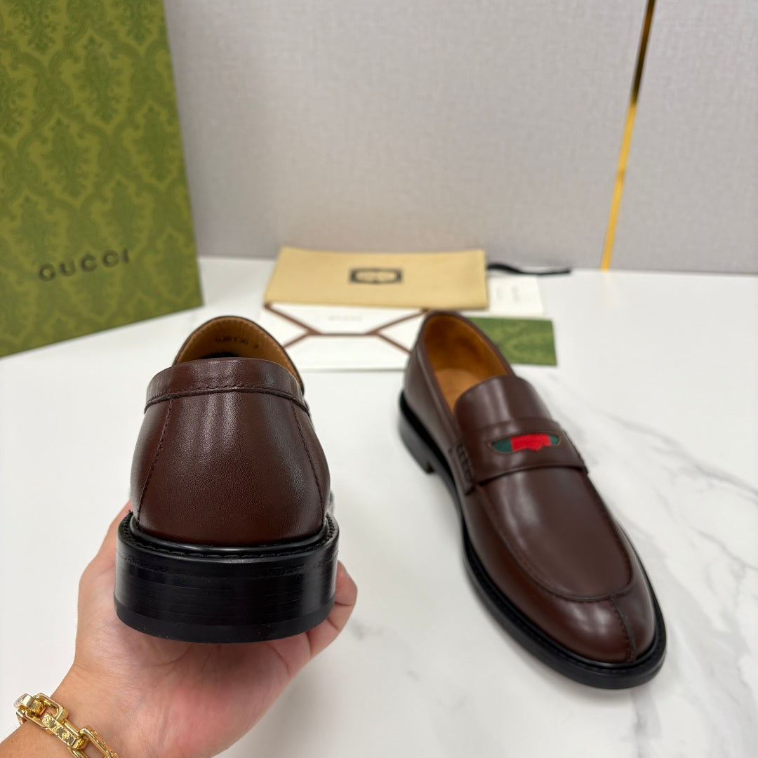Gucci unisex leather loafers rear view, dark brown with low profile sole and green-red stripe