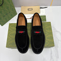 Gucci unisex black suede loafers with multicolor stripe and stitched apron toe.