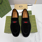 Gucci unisex black suede loafers with multicolor stripe and stitched apron toe.
