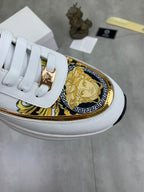 Versace white sneaker upper with gold decorative trim and emblem on the side panel