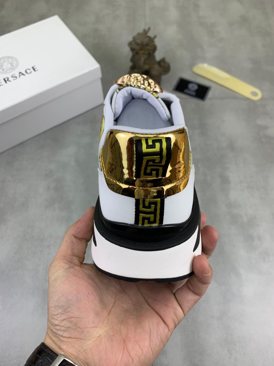 Versace white sneakers with gold rear heel detail and cushioned light-blue collar