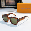 Tortoiseshell sunglasses with green-tinted lenses and LV logo on temple