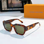 Tortoiseshell sunglasses with green-tinted lenses and LV logo on temple