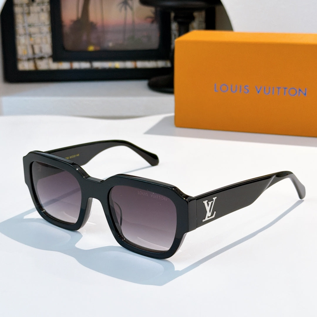 Black sunglasses with purple-tinted lenses and LV logo on temple