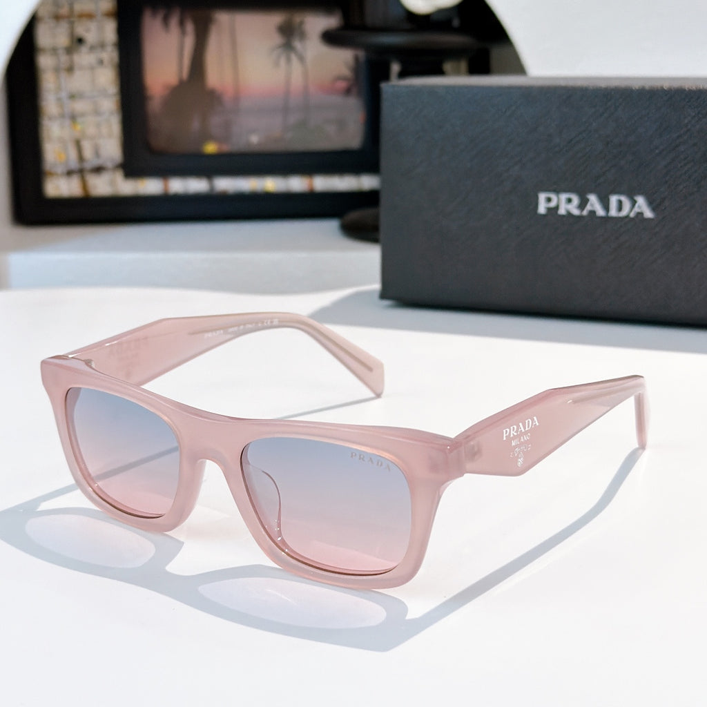Light pink square sunglasses with pale blue gradient lenses and Prada logo
