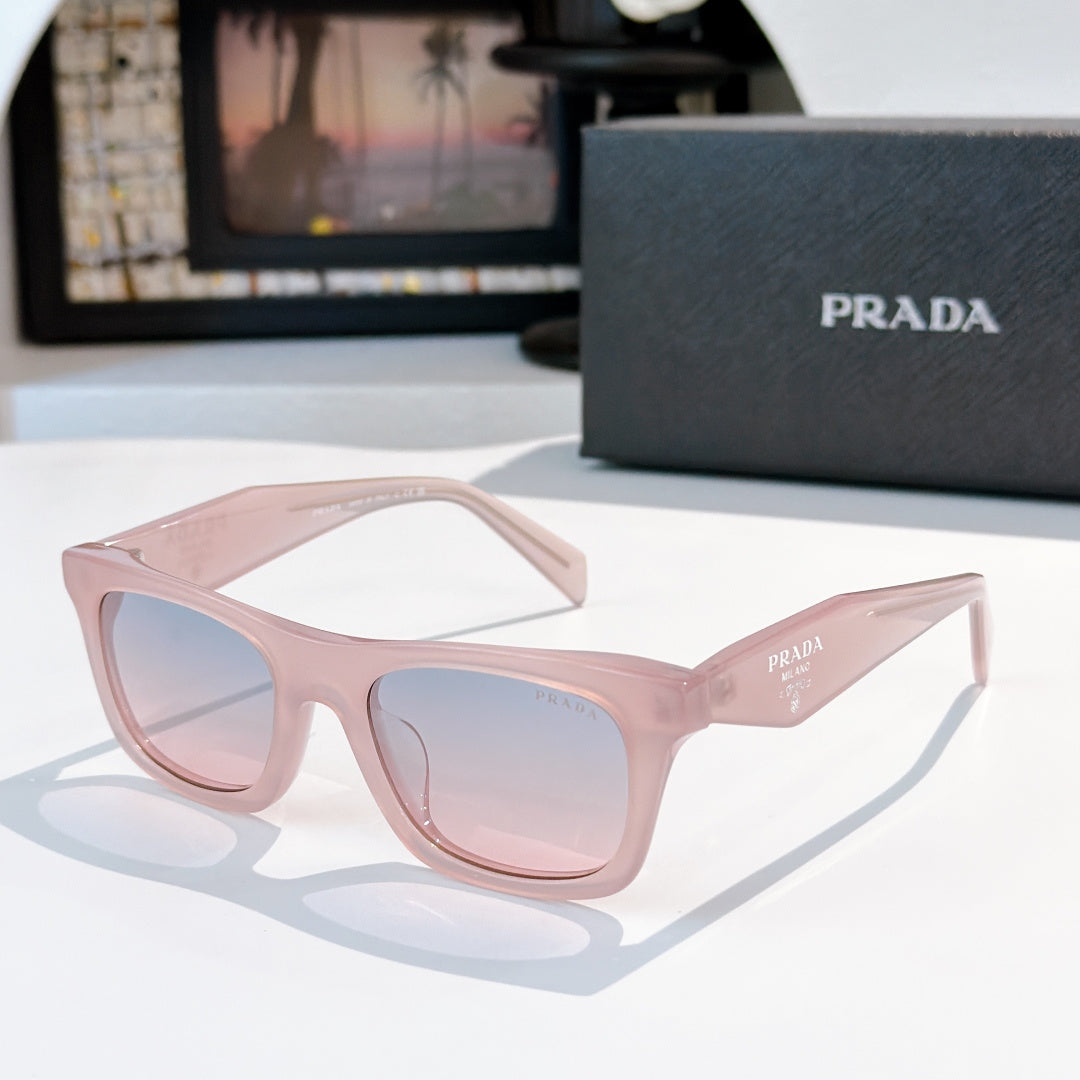 Light pink square sunglasses with pale blue gradient lenses and Prada logo