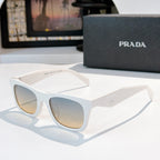White square sunglasses with gradient lenses and Prada logo on the temple