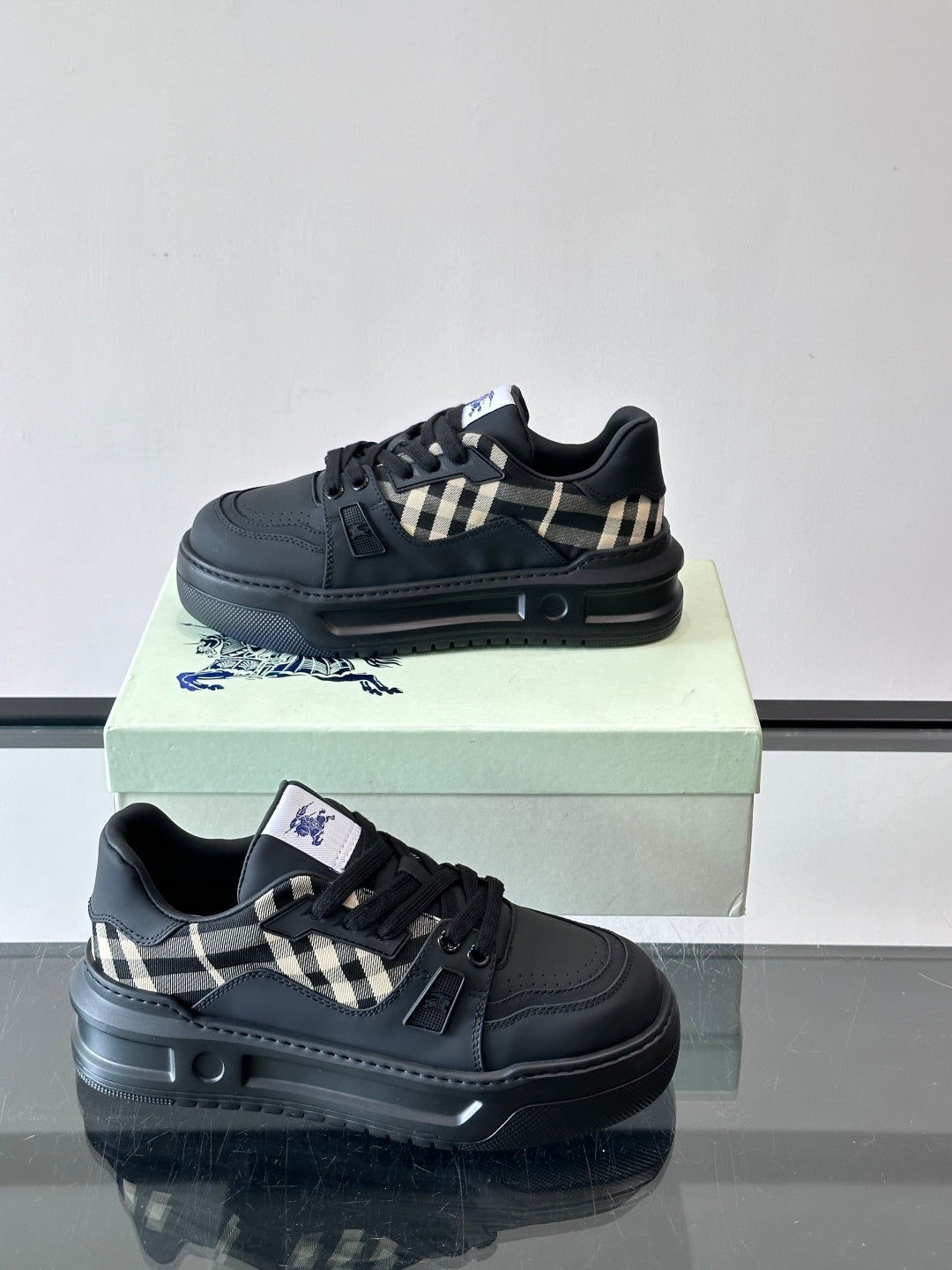 Black lace-up sneakers with check strap detail and contrast midsole