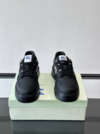 Pair of black lace-up sneakers with check panel detail on the sides