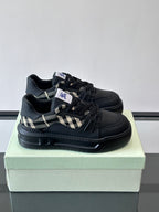 Black lace-up sneakers with check panel detail and chunky rubber sole