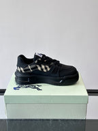 Black lace-up sneaker with check panel detail on the side strap