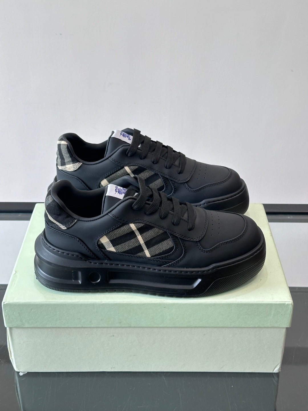 Burberry low-top sneakers, dark leather with check panel and black laces