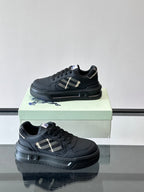 Dark leather low-top sneakers, plaid detail on side and thick rubber sole