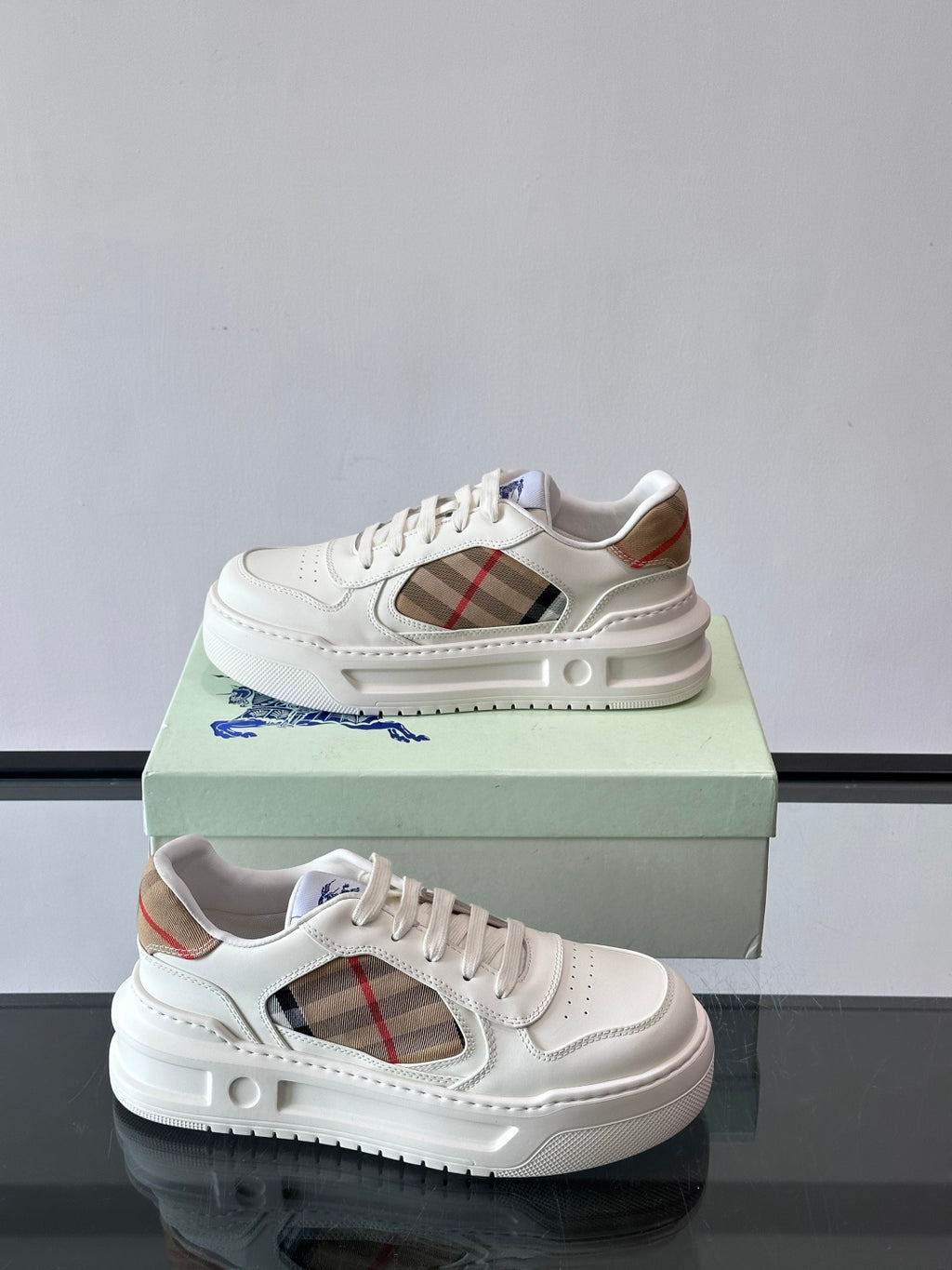 White sneakers with plaid side opening and contrast lining at collar