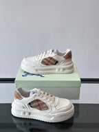 White sneakers with plaid side opening and contrast lining at collar