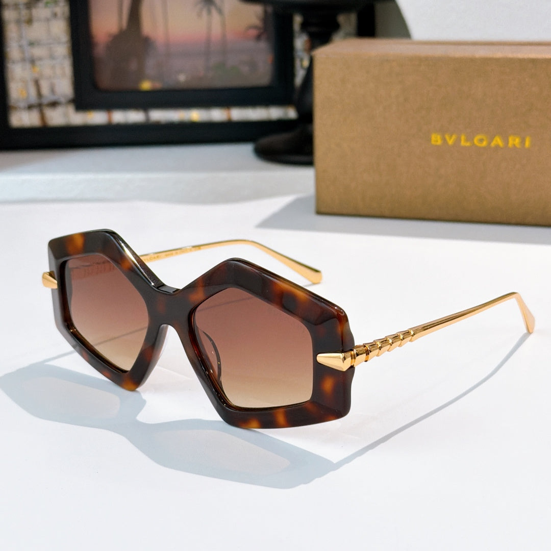Dark tortoise octagonal sunglasses with brown gradient lenses and gold-tone temples