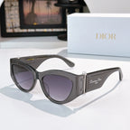Cat-eye sunglasses with dark gray frame and lavender-tinted lenses.