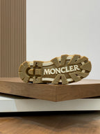 Suede ankle boot outsole with chunky tread and Moncler logo on the sole.