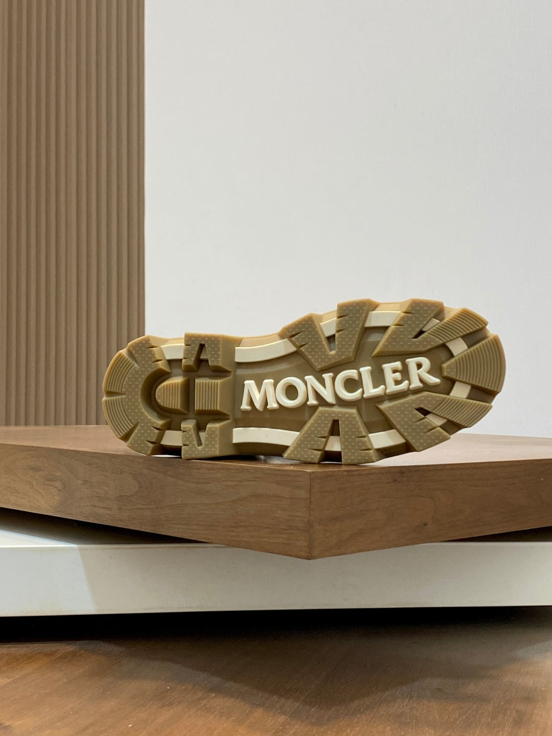 Suede ankle boot outsole with chunky tread and Moncler logo on the sole.