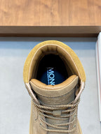 Tan suede high-top boot interior with branded lining and lace-up front