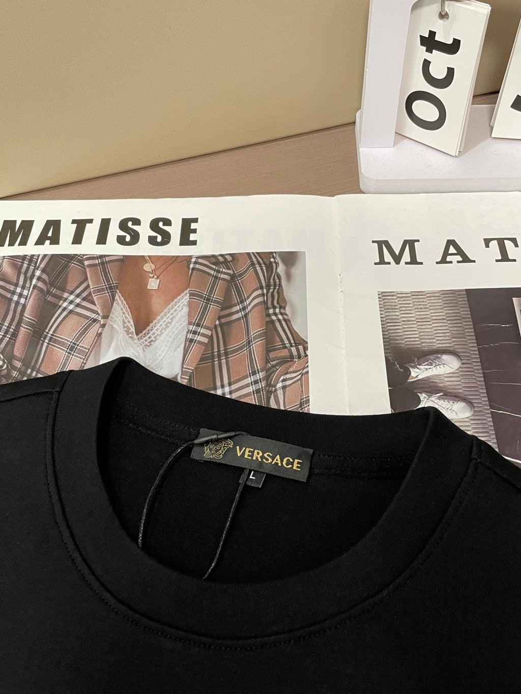 Black crewneck sweatshirt neckline and inner collar label