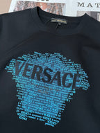 Black crewneck sweatshirt with large blue text face graphic center front