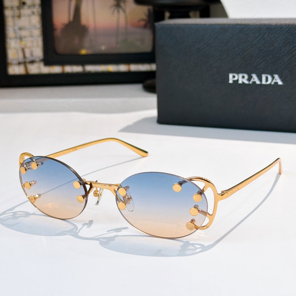 Prada sunglasses with round light-blue lenses and gold-tone studded frame, slim metal arms