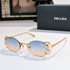 Prada sunglasses with round light-blue lenses and gold-tone studded frame, slim metal arms