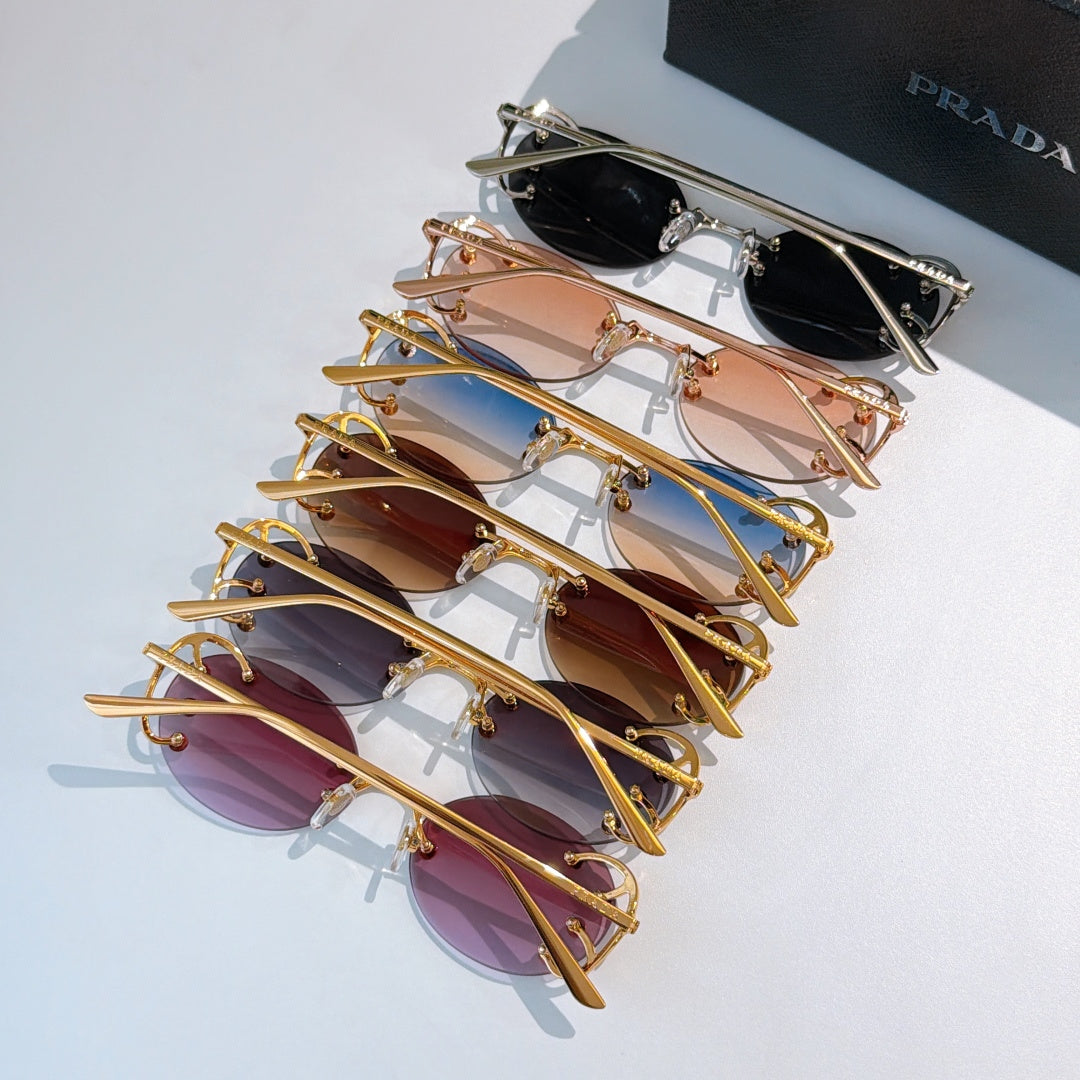 Set of Prada sunglasses with assorted tinted lenses and gold-tone frames, stacked