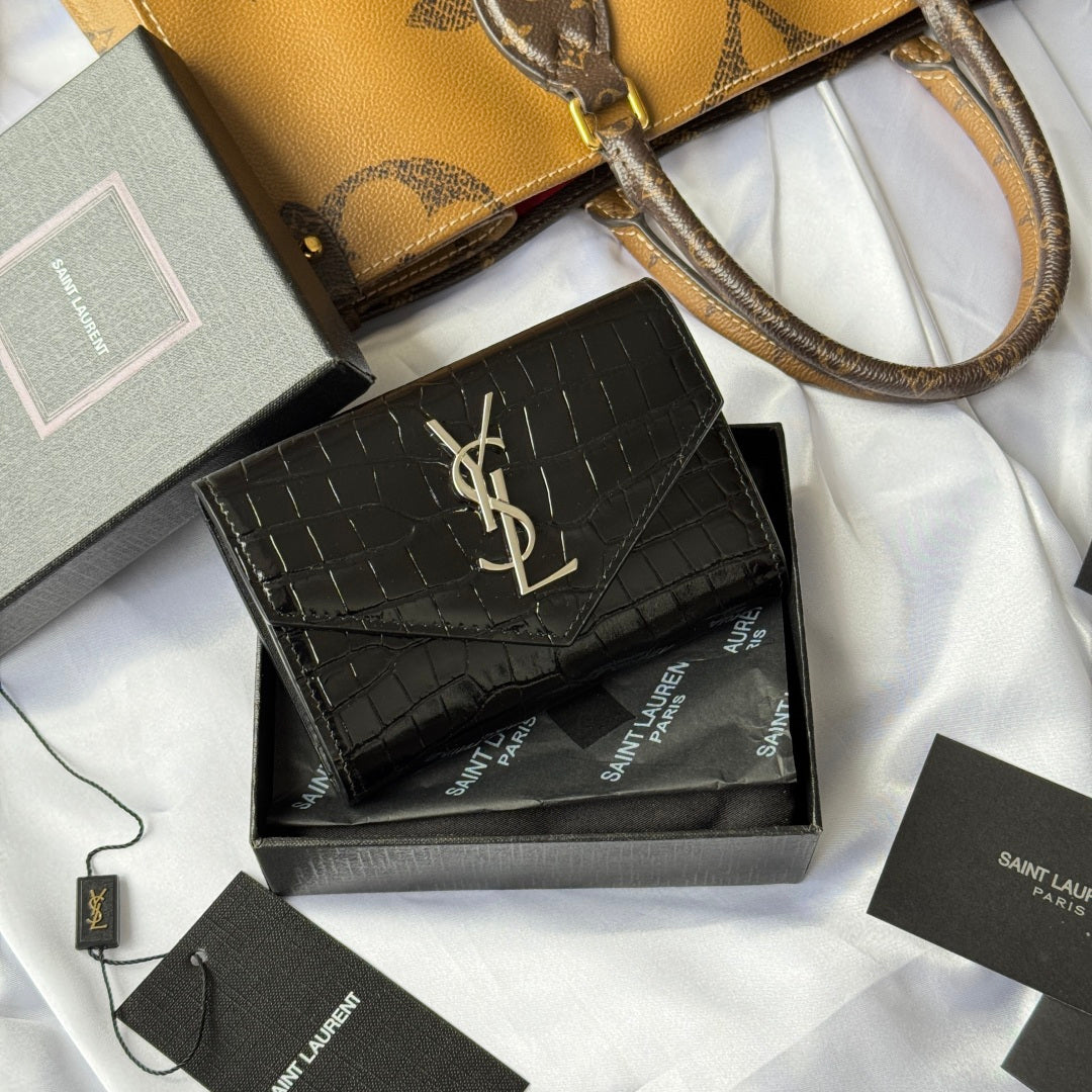 Black small leather bag with croc texture, gold YSL logo, shown in gift box