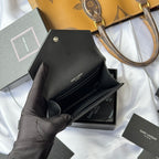 Black small leather bag interior with card slot and SAINT LAURENT printed label