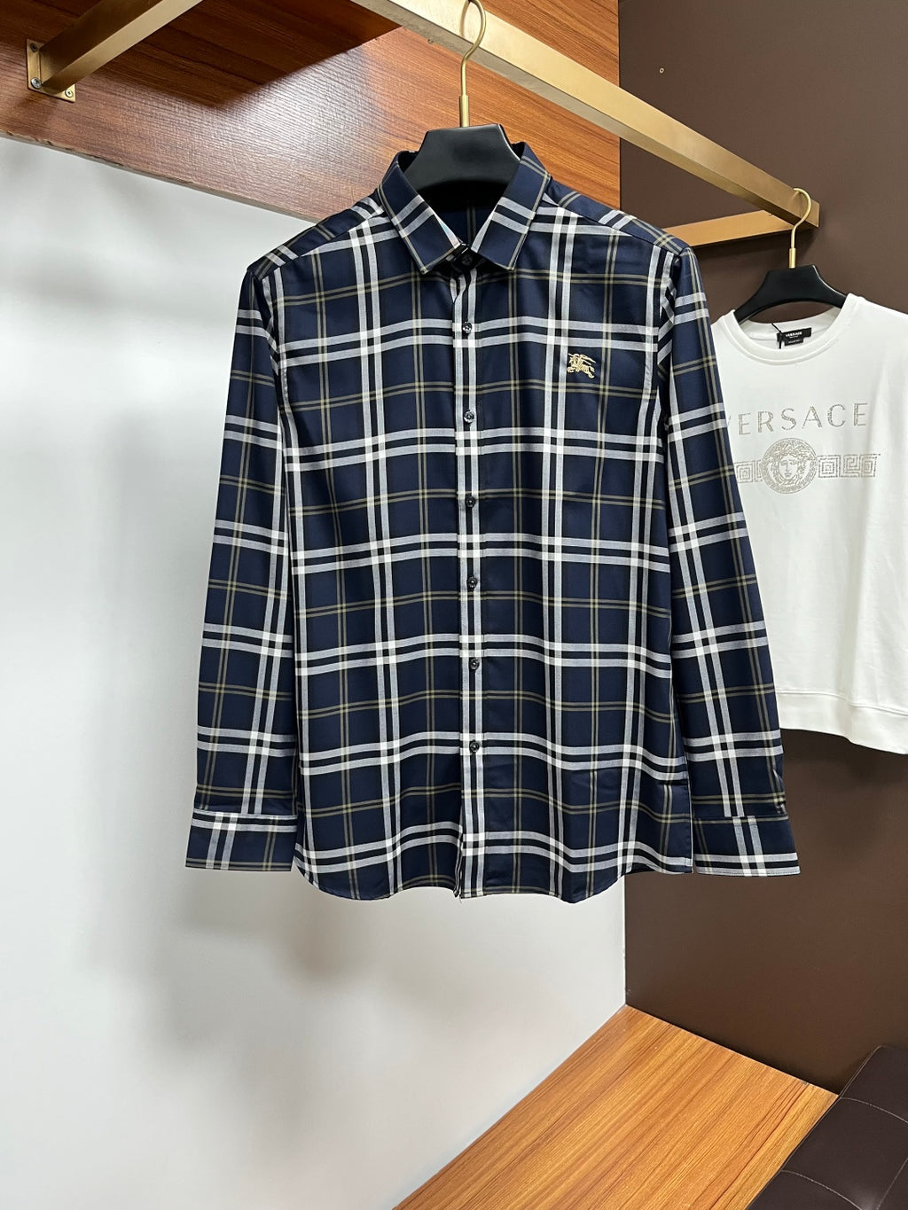 Navy plaid long-sleeve button-up shirt with pointed collar and front buttons