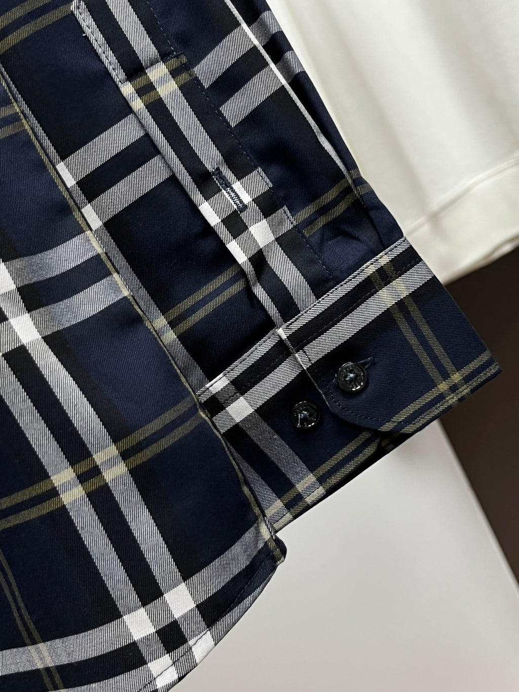 Navy plaid long-sleeve shirt with cuff and side seam button detail
