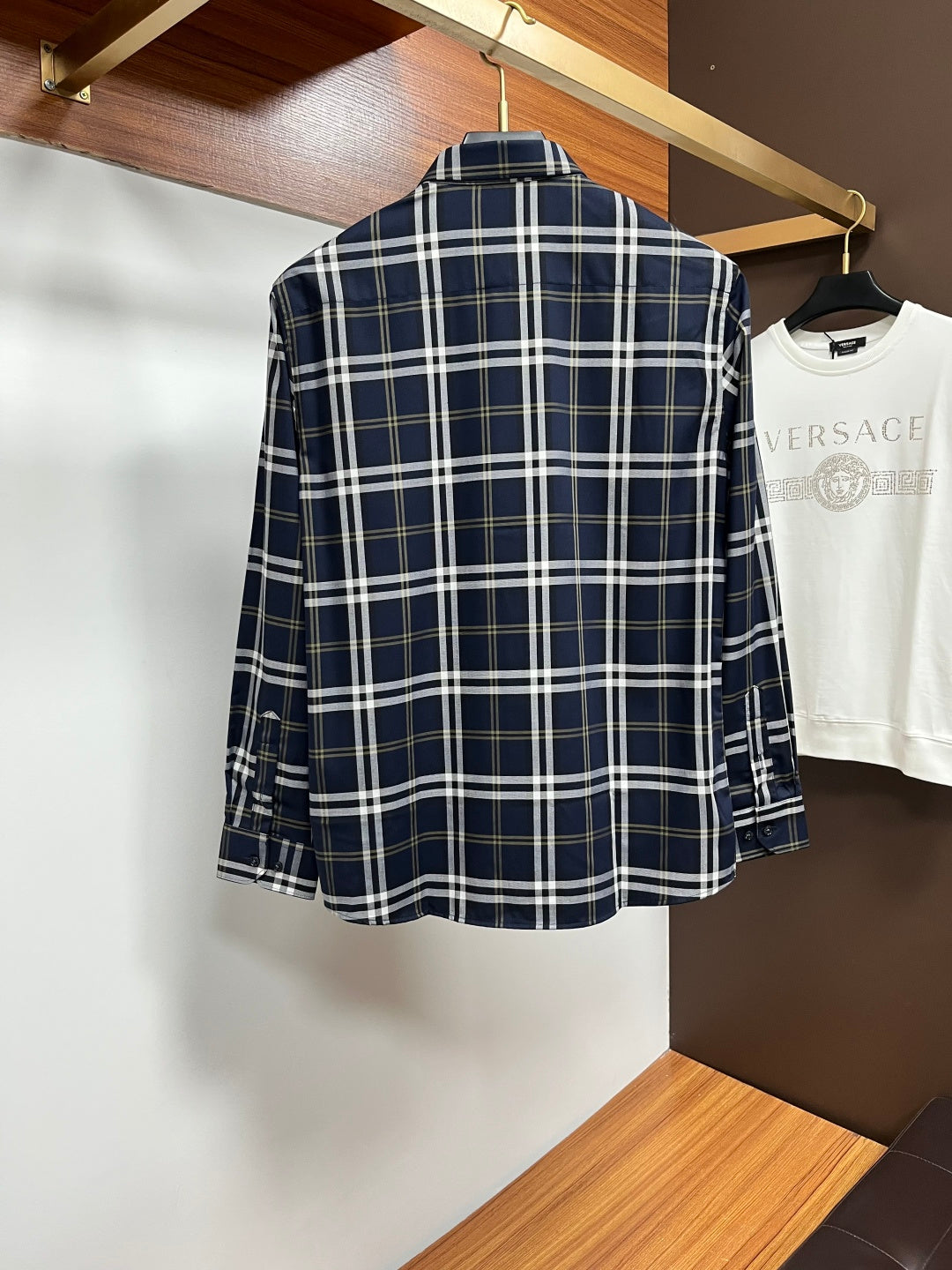 Navy plaid long-sleeve button-up shirt, back view with yoke and button placket
