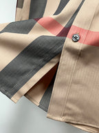 Burberry plaid long-sleeve shirt cuff close-up with button and check pattern