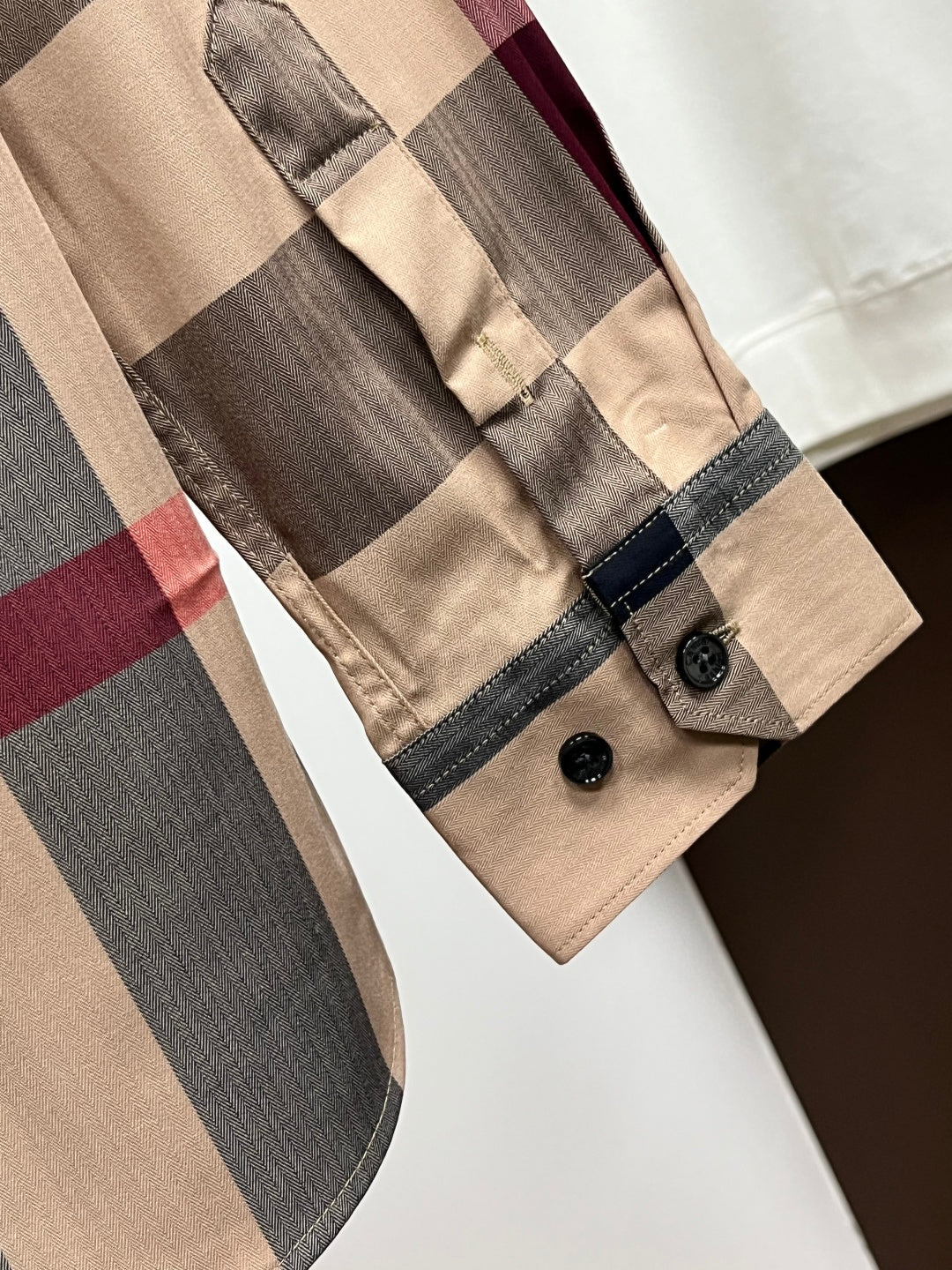 Burberry plaid long-sleeve shirt sleeve cuff with black button detail