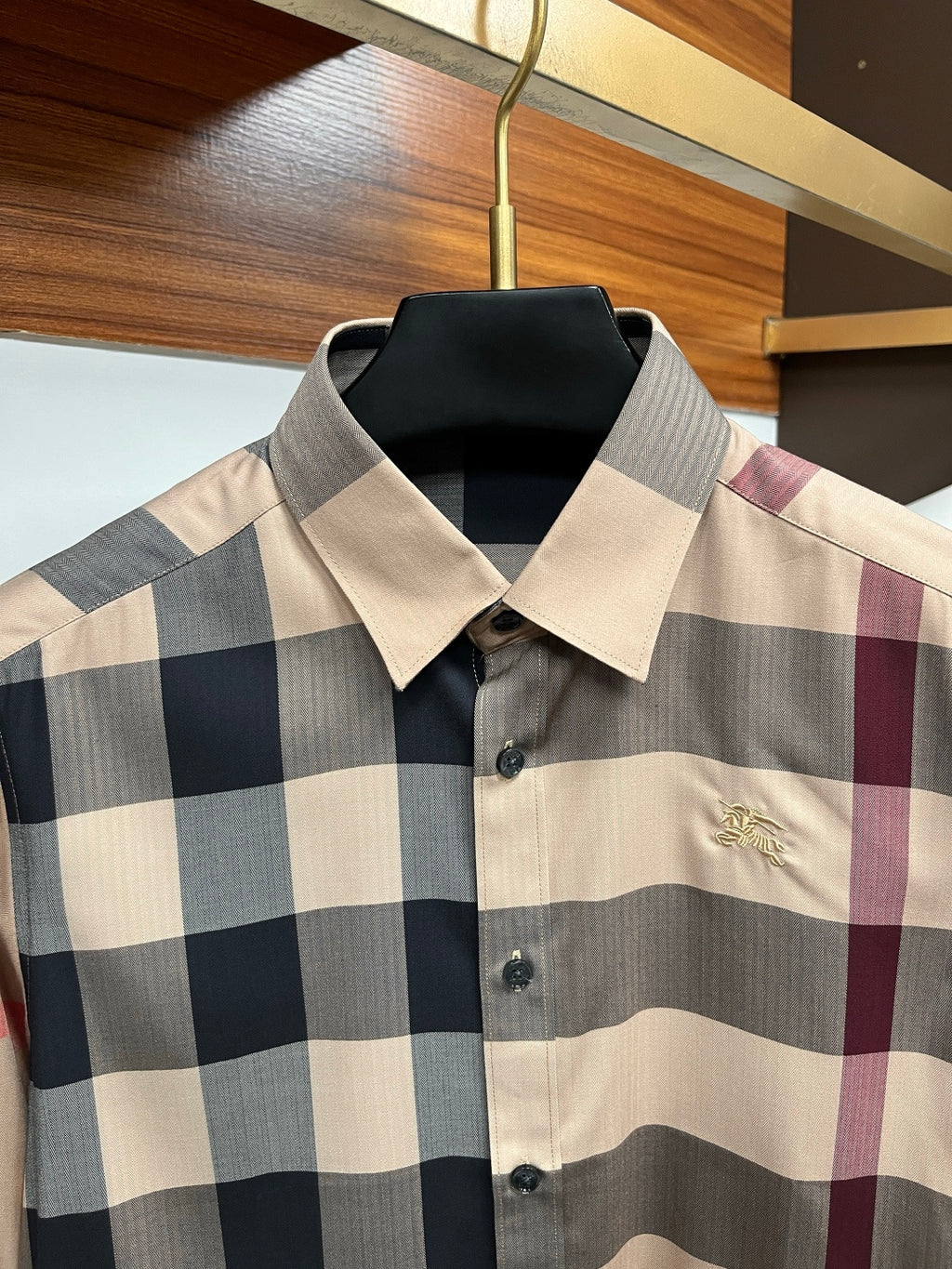 Burberry plaid long-sleeve shirt with spread collar and black buttons; gold crest